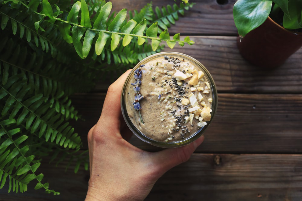 A nutritious breakfast smoothies topped with chia seeds and dried lavender buds